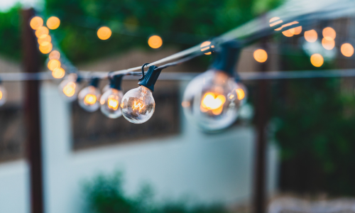 A close up of patio string lights